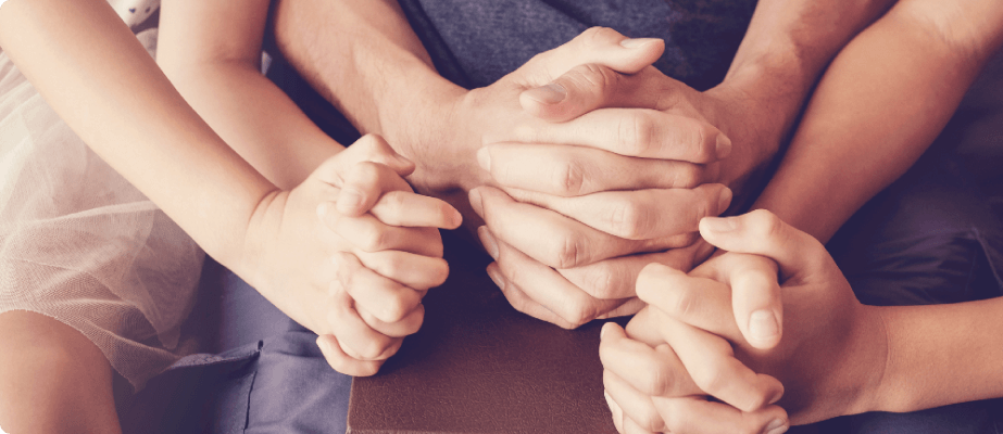 Praying hands of various ages