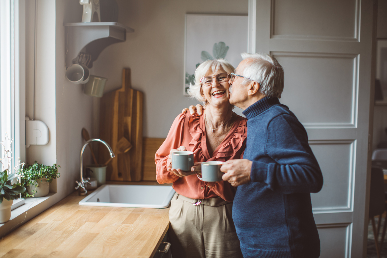 Senior couple at home experiencing happiness