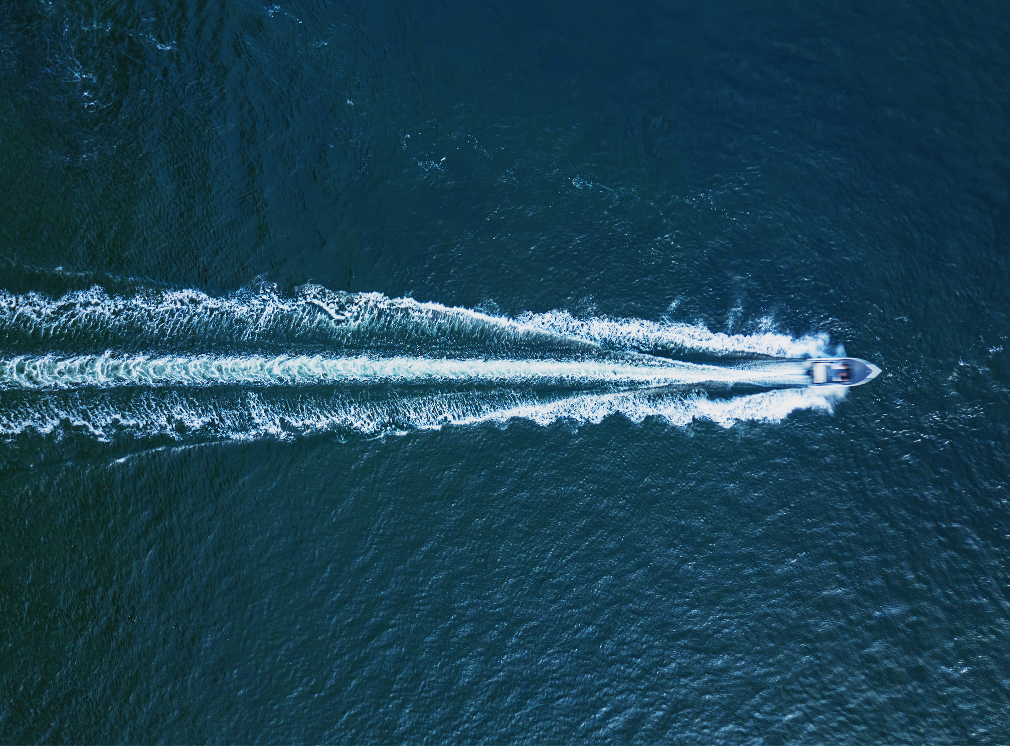 Aerial view of a powerboat in open ocean