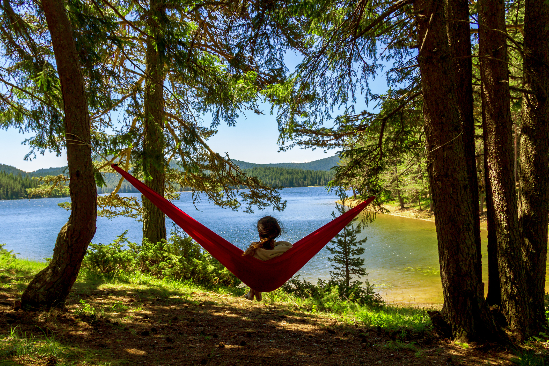 Girl standing in the hammock and rest