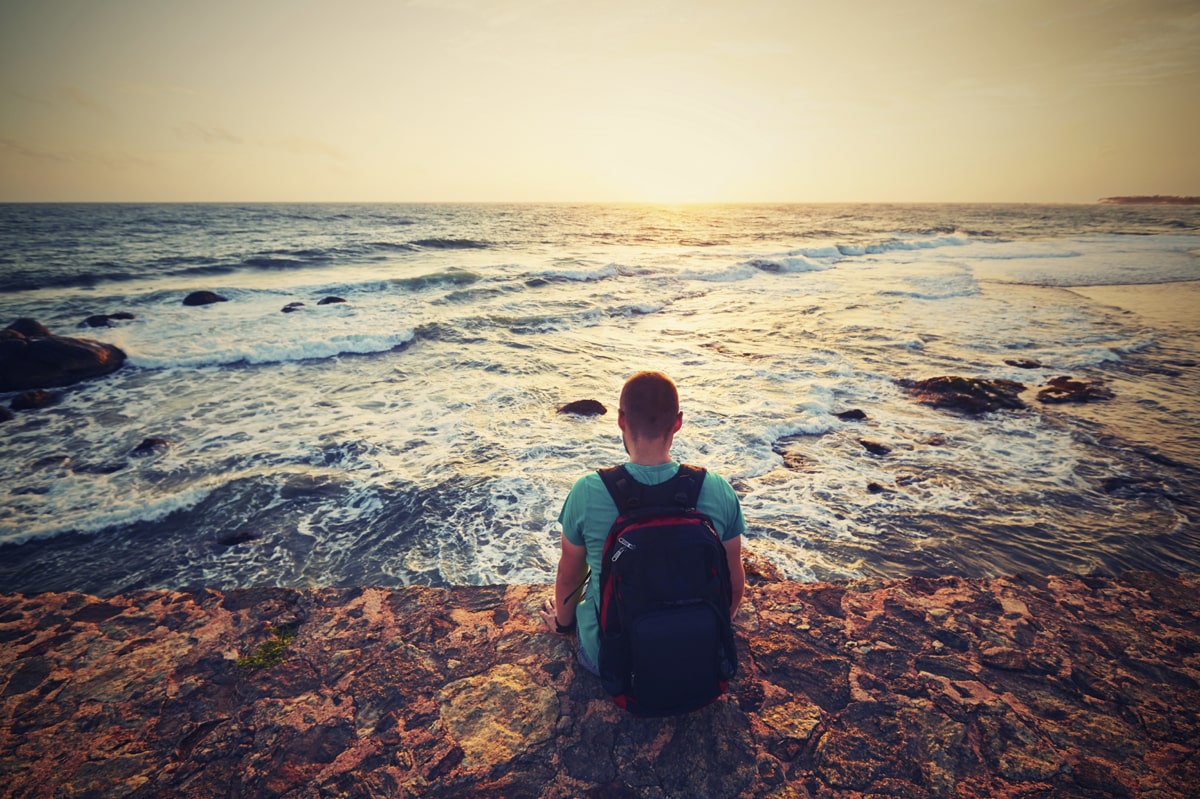 A man sitting on the seashore