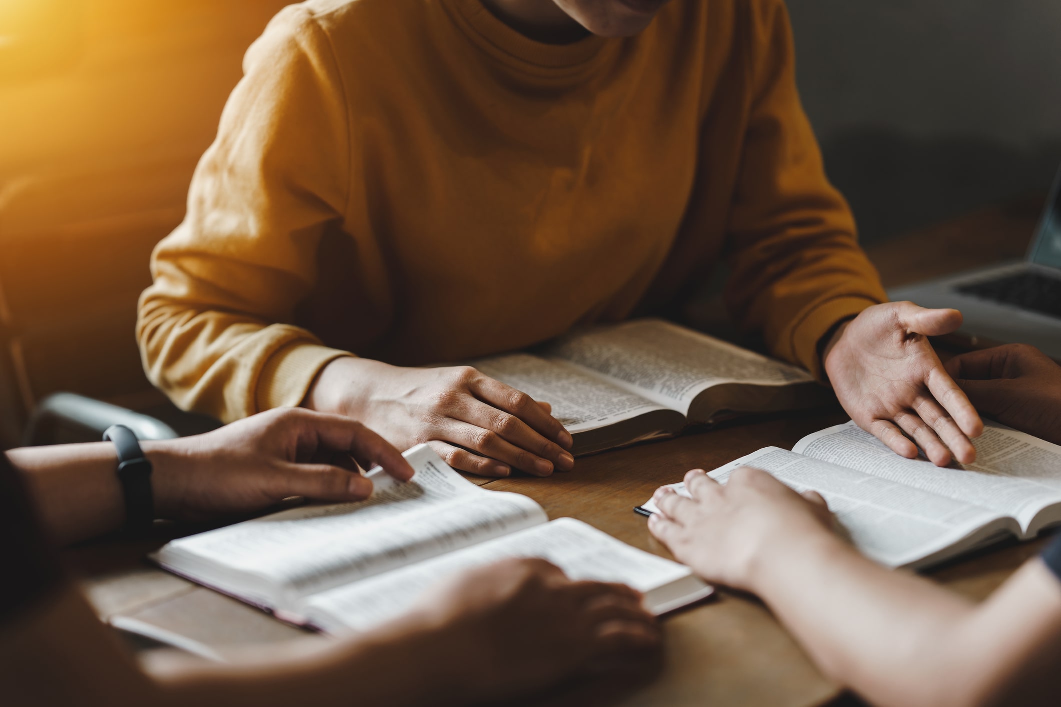 Christian couple or group reading study the bible together